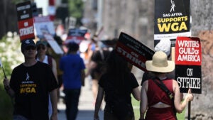 Members of SAG-AFTRA have been joining WGA picket lines in solidarity. (Photo by Mario Tama/Getty Images)