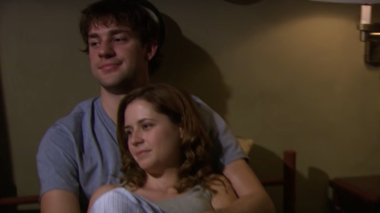 Jim and Pam cuddling in The Office