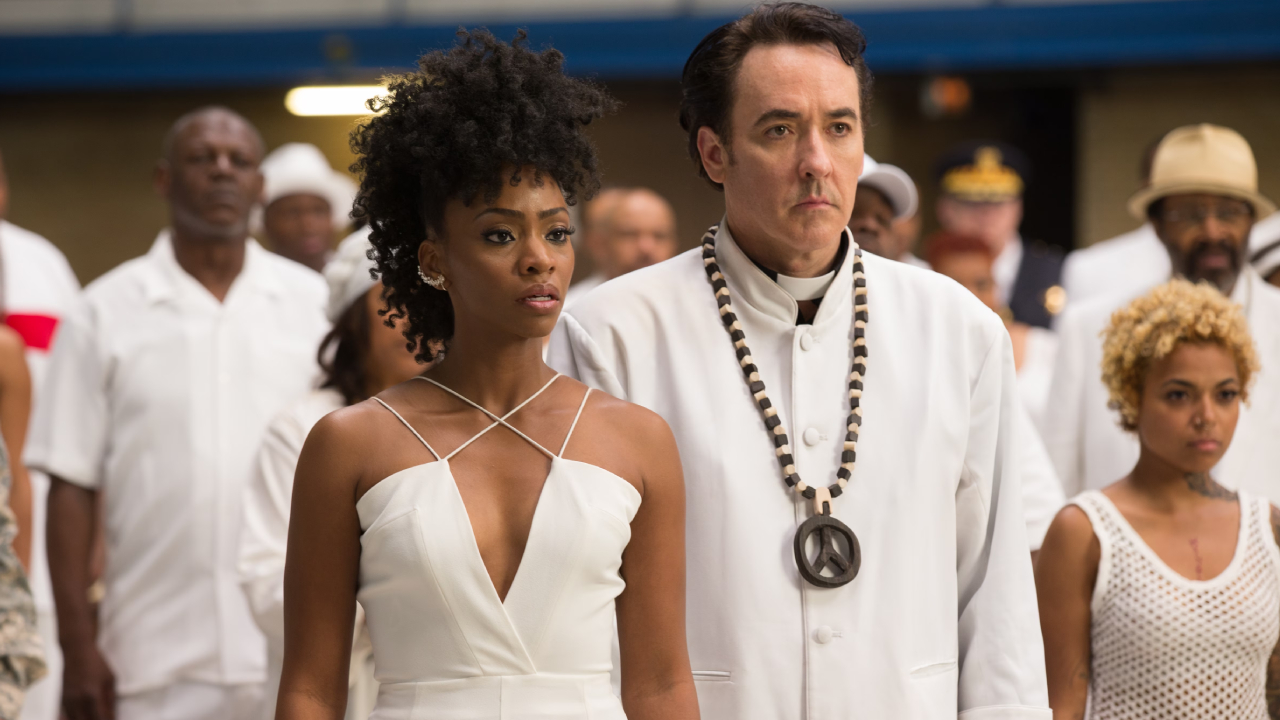 Teyonah Parris et John Cusack dans Chi-Raq