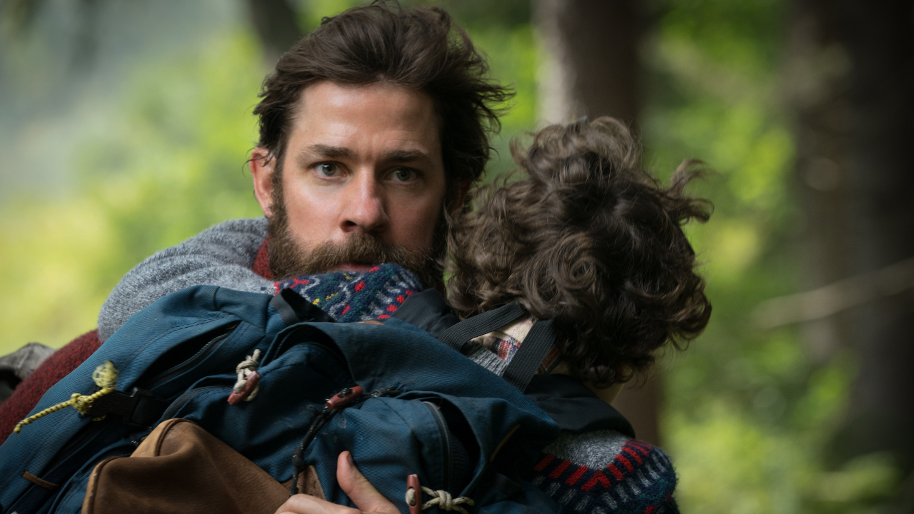 John Krasinski courant avec un enfant dans A Quiet Place